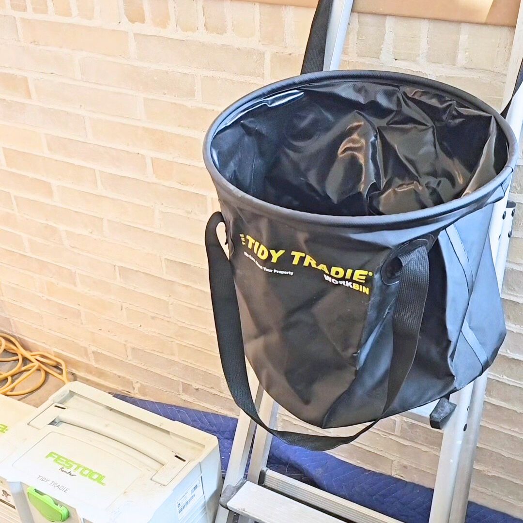 TIDY TRADIE Work Bins keep the site clean.