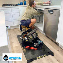 Load image into Gallery viewer, A professional with his tools on a medium tidy tradie work mat, to protect the timber floor.
