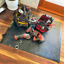 Load image into Gallery viewer, A large tidy tradie work mat protects the timber floor from dirty constuction tools
