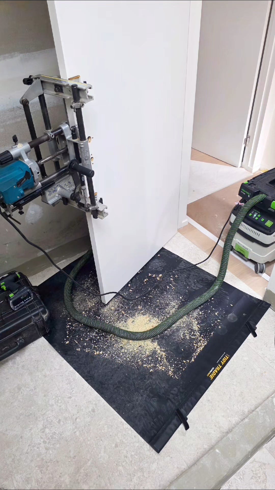 Large tidy tradie work mat catching all the dust.