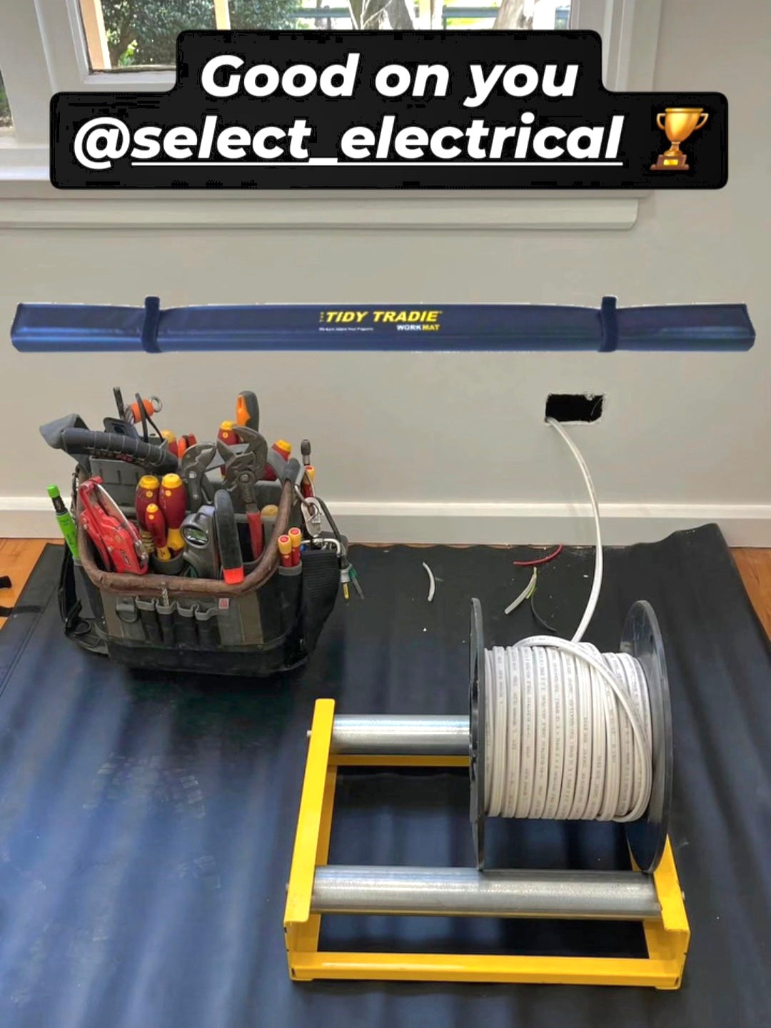 A large Tidy Tradie work mat 2.0 on the job. Used by an electrician.