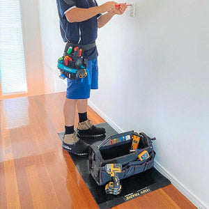 Medium size Tidy Tradie work mat, used by an electrician to protect the timber floor.