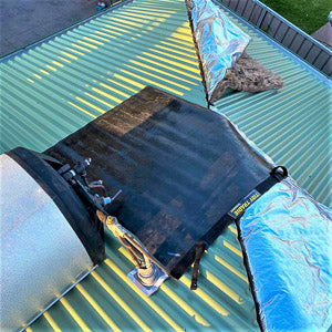 A roofer placed a large size tidy tradie work mat over the corrugated iron to prevent any scratches or damage.